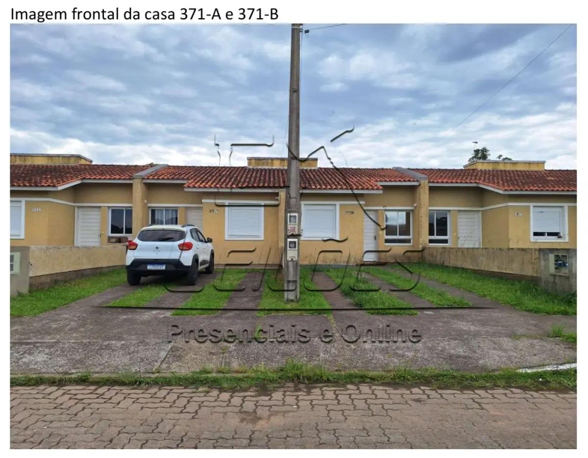 Casa de alvenaria sob nº 371-A, geminada, com a área construída de 43,48m², situada na Rua em Esteio/RS